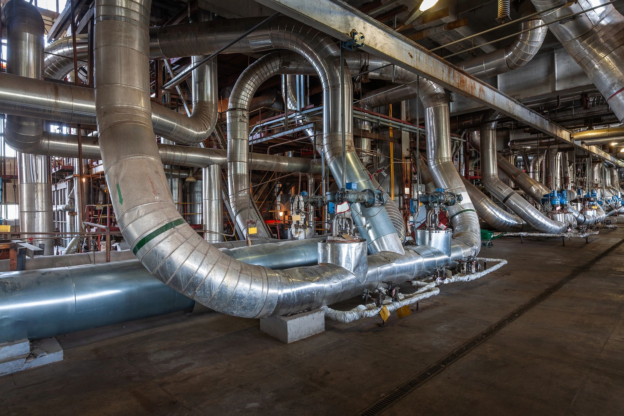 Industrial pipes and valves in a power station setting